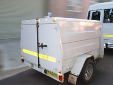 Large covered luggage trailer for hire